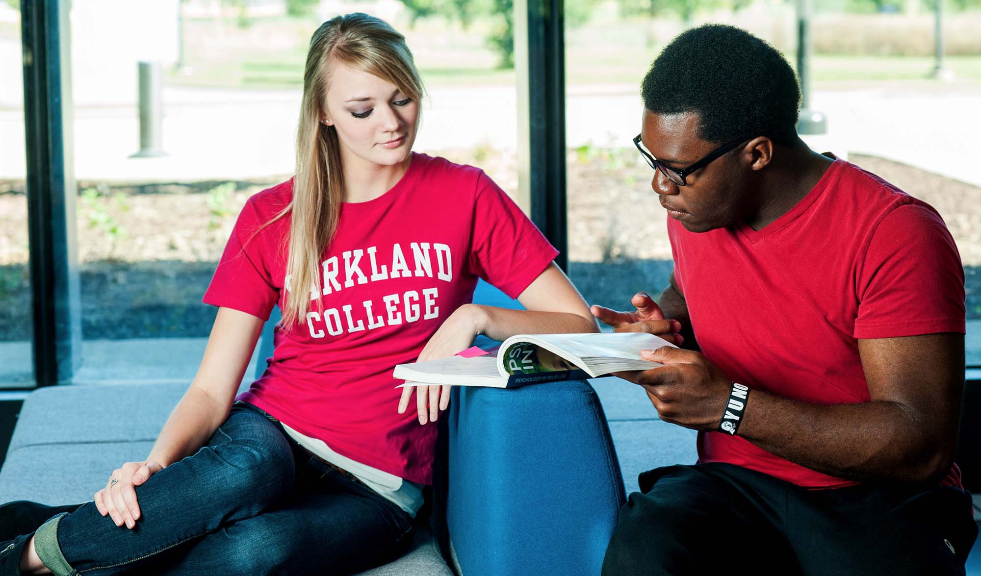 Students examining book
